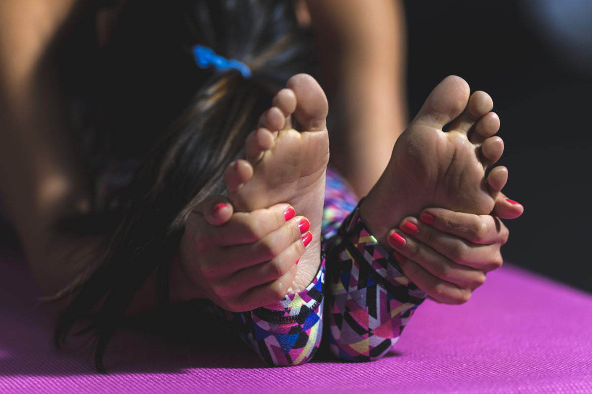 yoga forward fold feet
