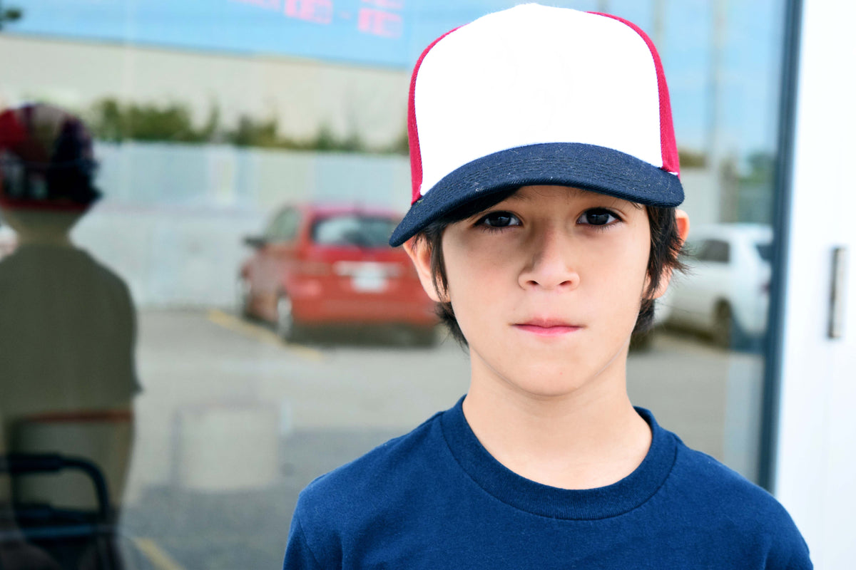 young child in ball cap