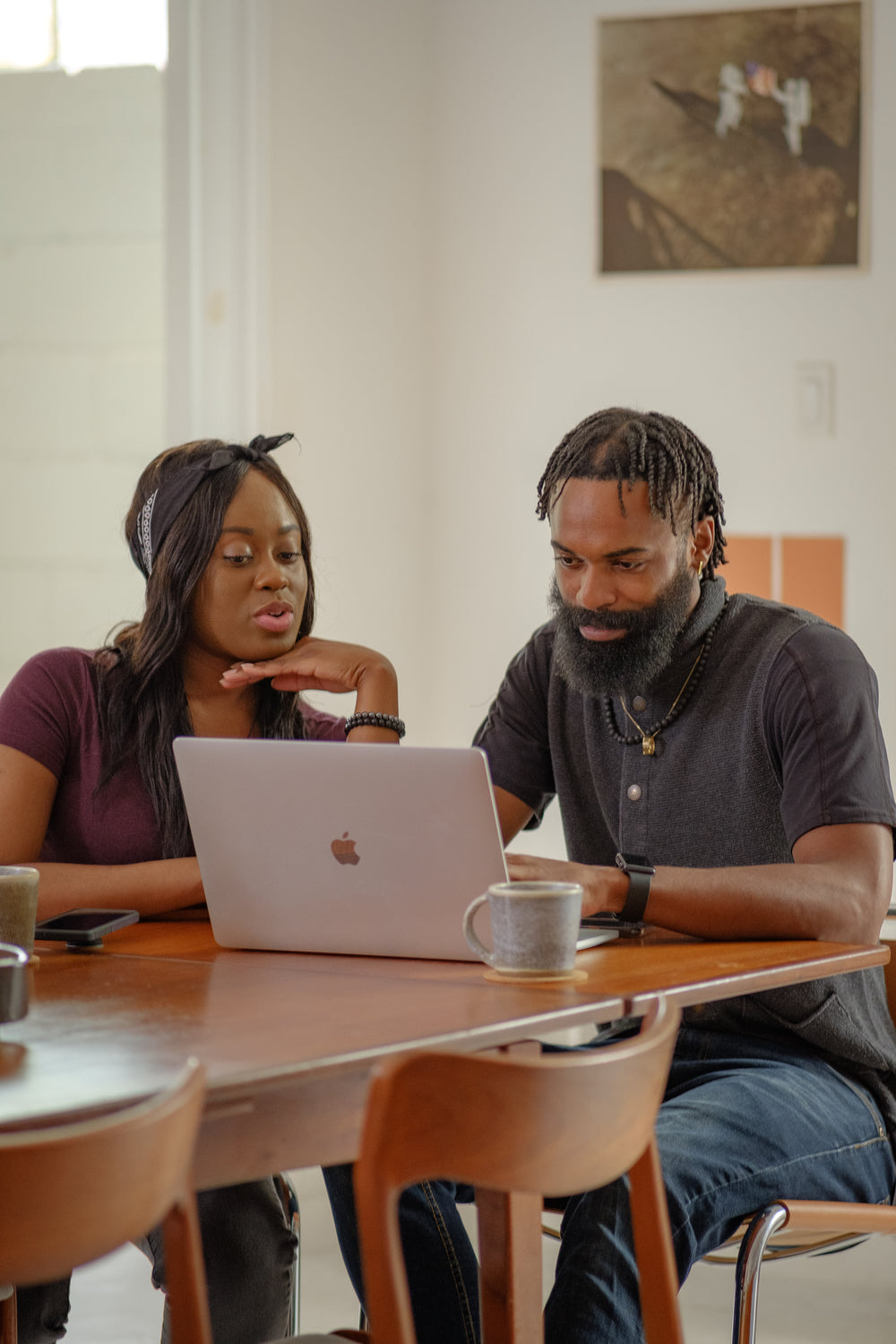 young couple sharing a laptop