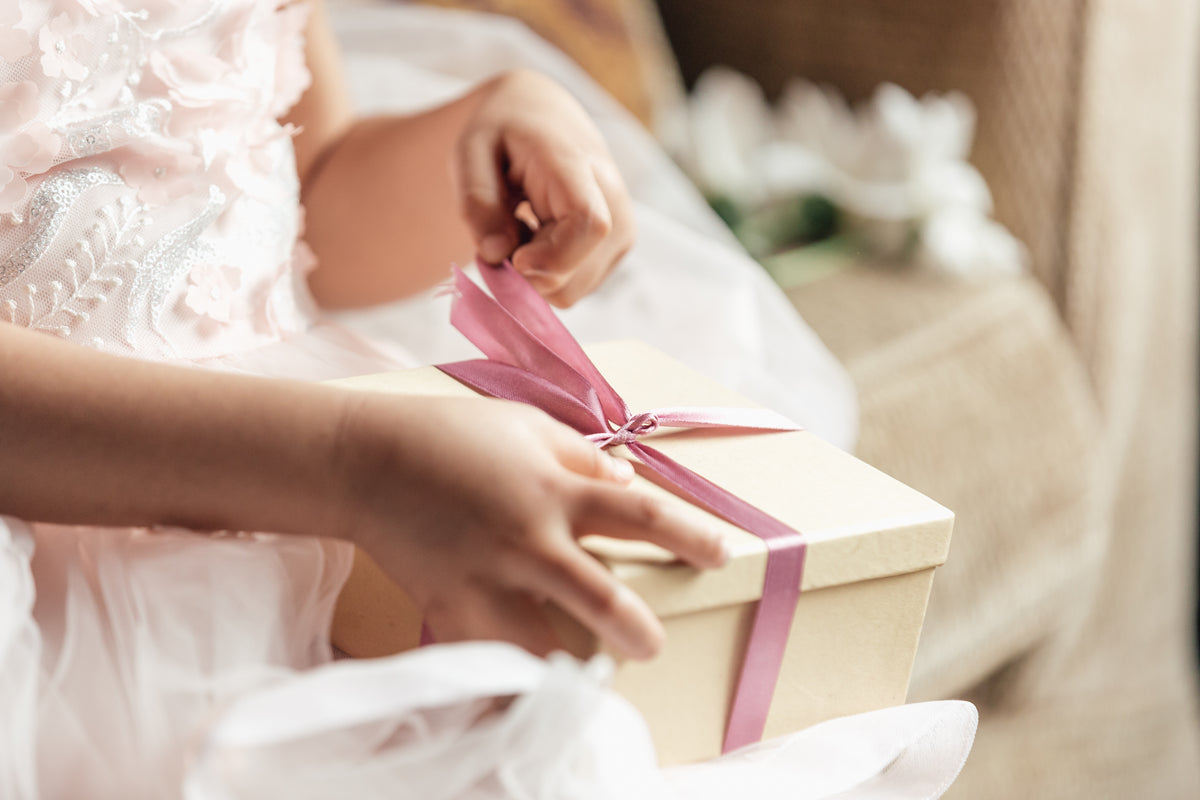 Young Girl Opening Gift