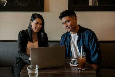 young man and woman at table in coffee shop