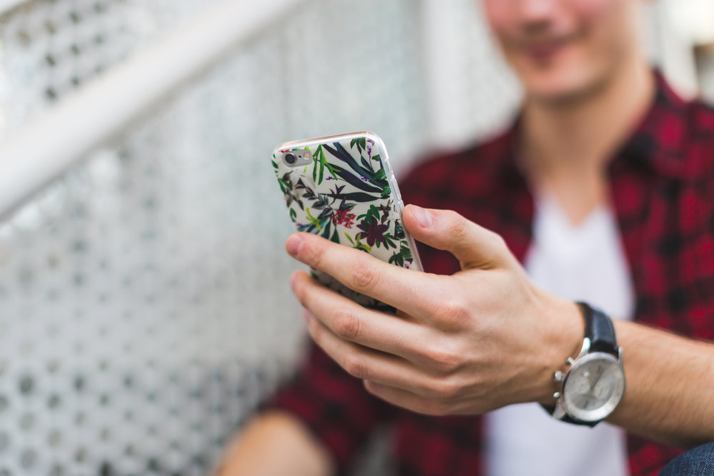 young man checking phone