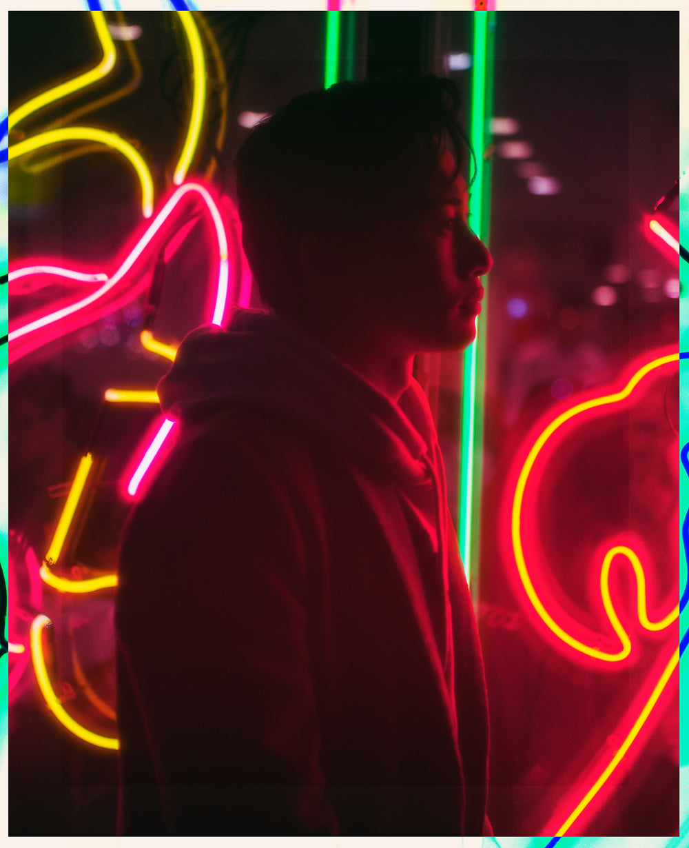young man in neon lights