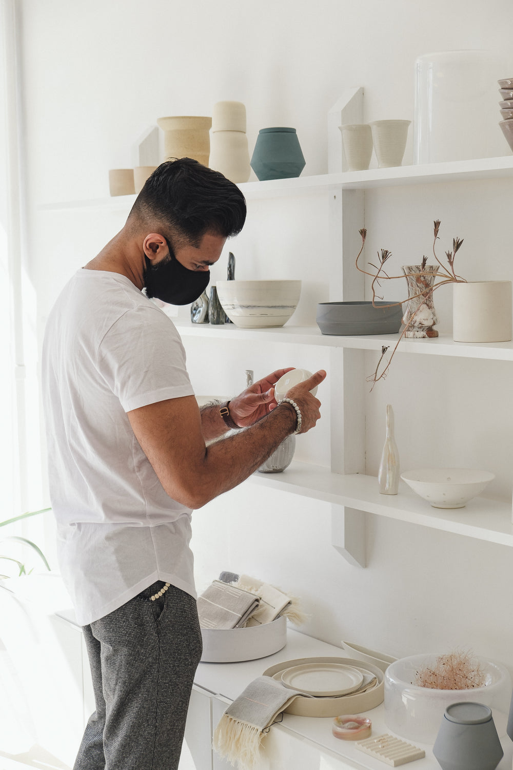 young man looks at merchandise in local store