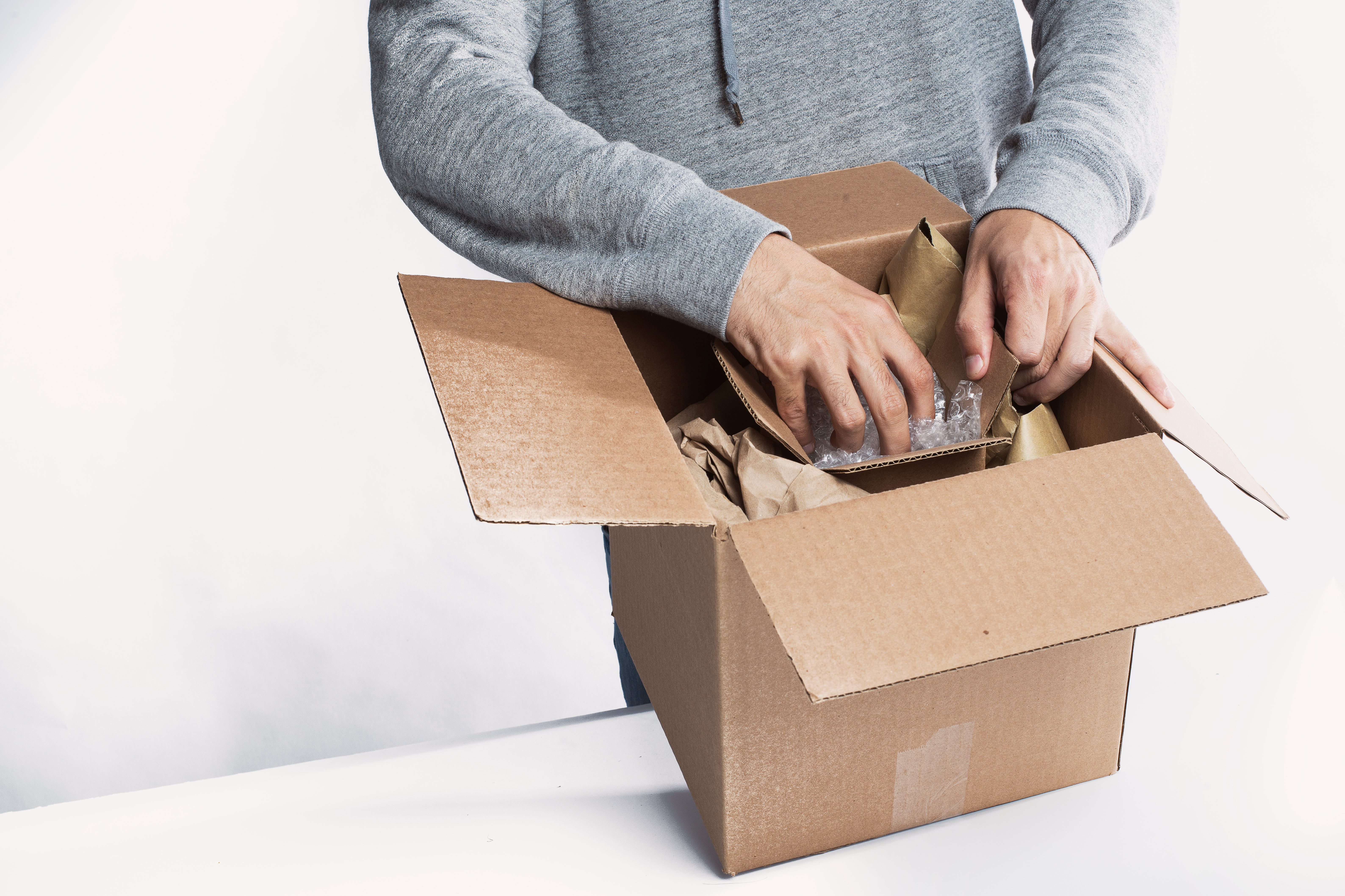 Young Man Preparing A Package For Fulfillment