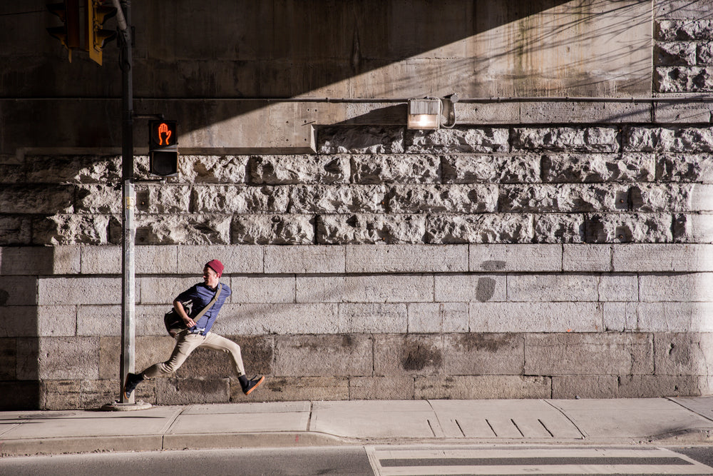 young man runaway on urban street