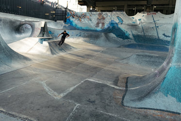 young man skateboarding in underground skatepark