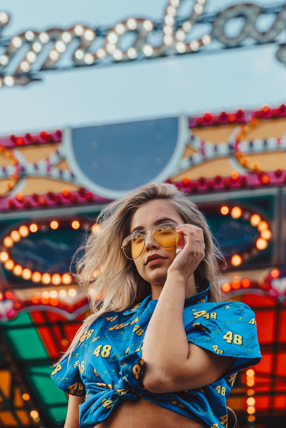 young model with carnival lights