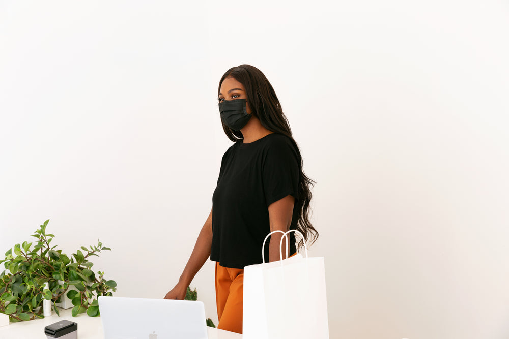 young store owner behind her counter