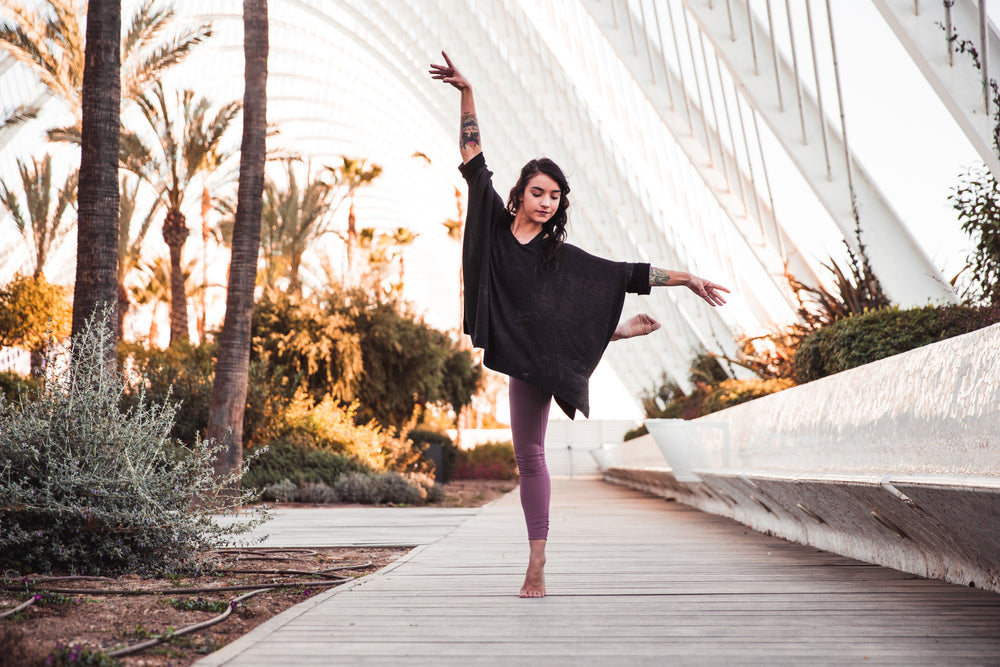 young woman dances with nature