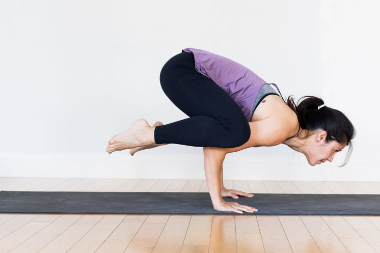 Young Woman Doing Yoga Balancing