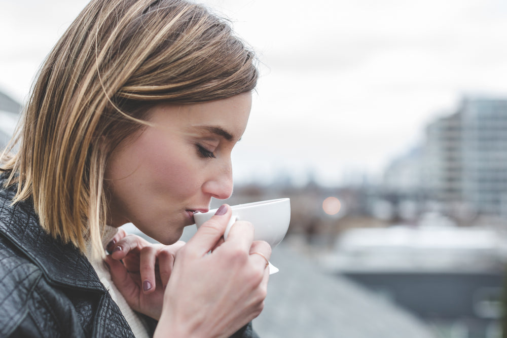 young woman drinking tea