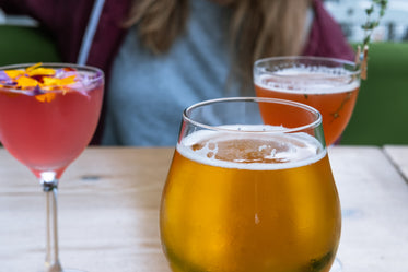 young woman enjoying the sun and a few drinks