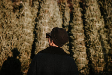 young woman looking into the trees