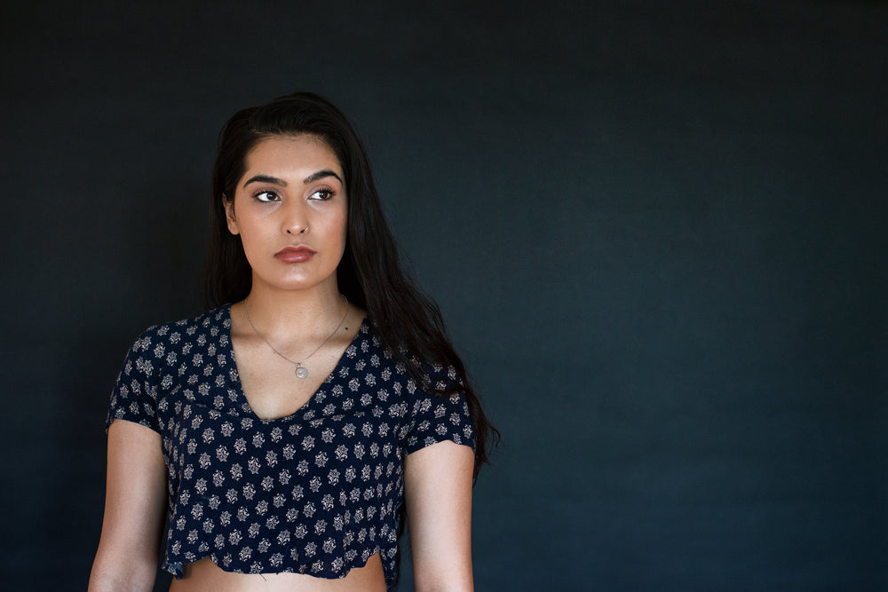 young woman looks past the camera