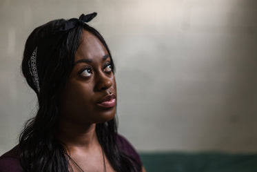 young woman looks up