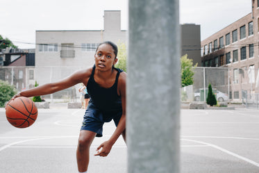 young woman practices her dribbling skills