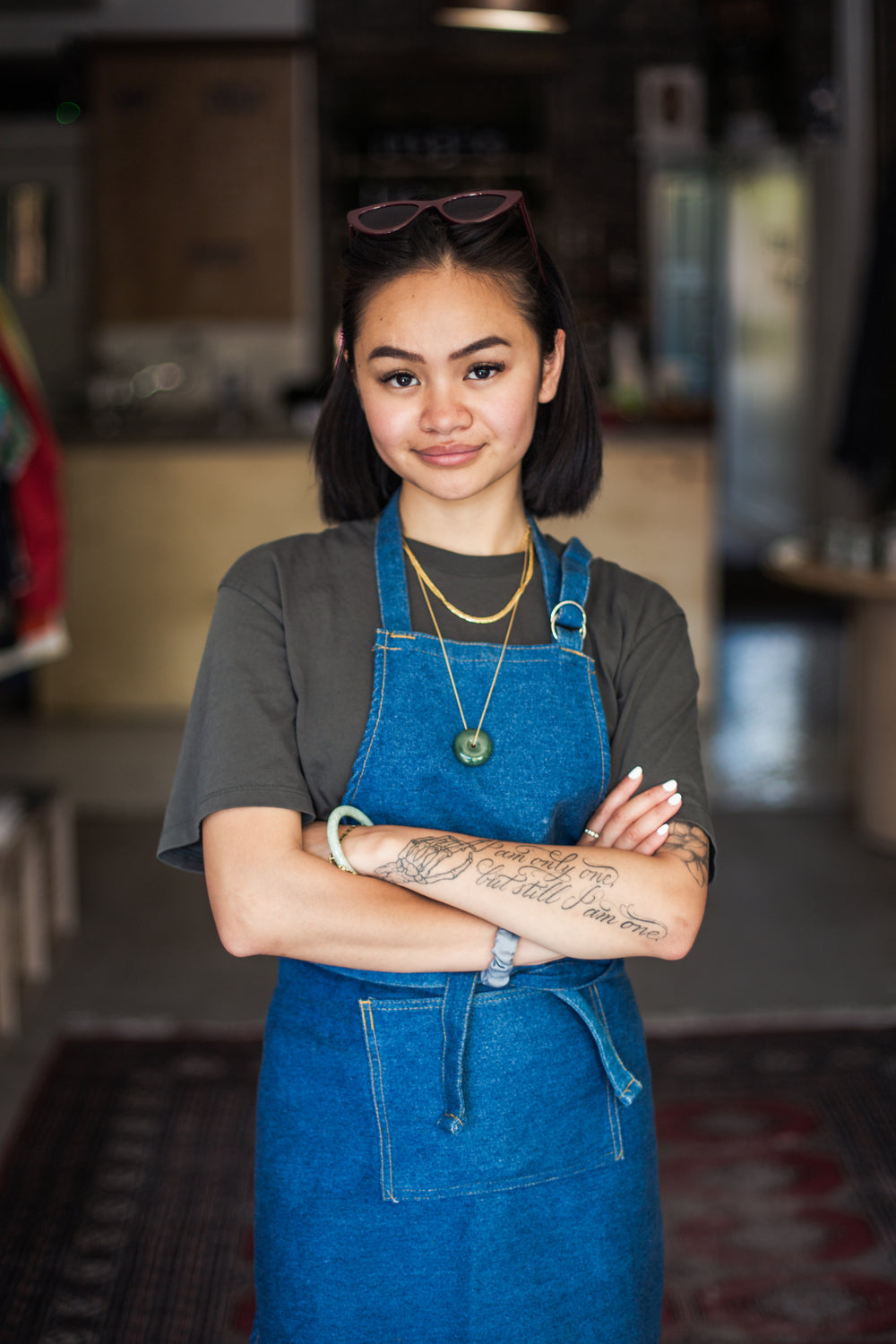 young woman stands at front of her retail store