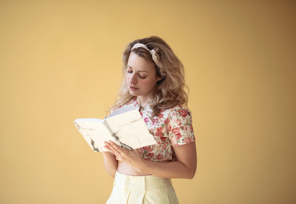 young woman takes notes