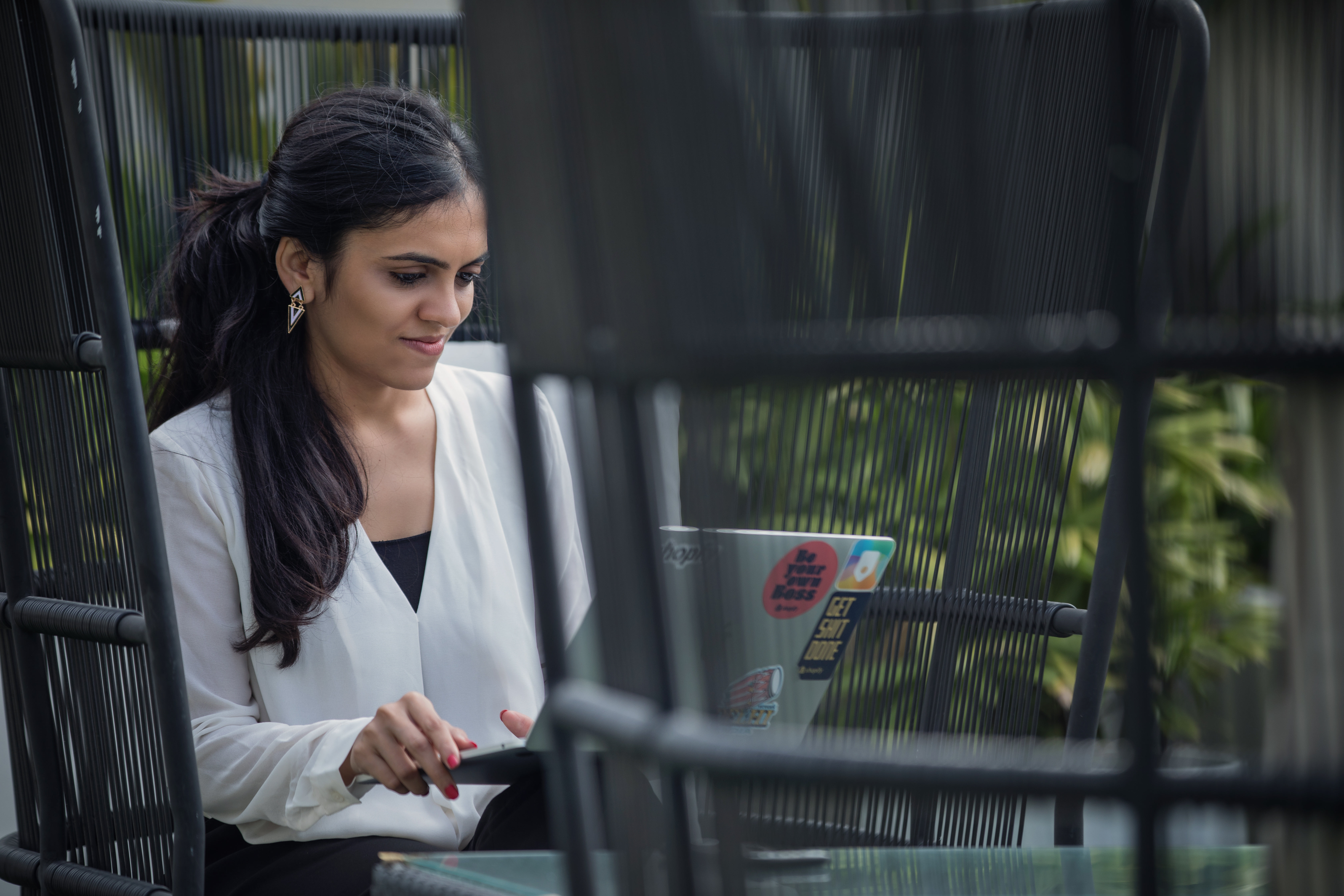 Young Woman Working On Her Laptop Outside