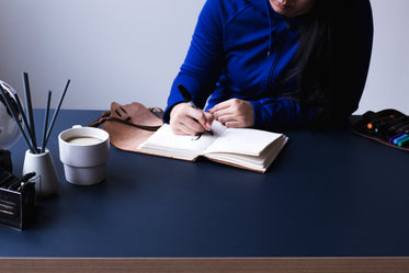 young woman writing in notebook